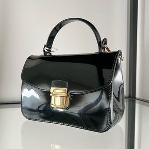 Patent mini handbag with gold detail
